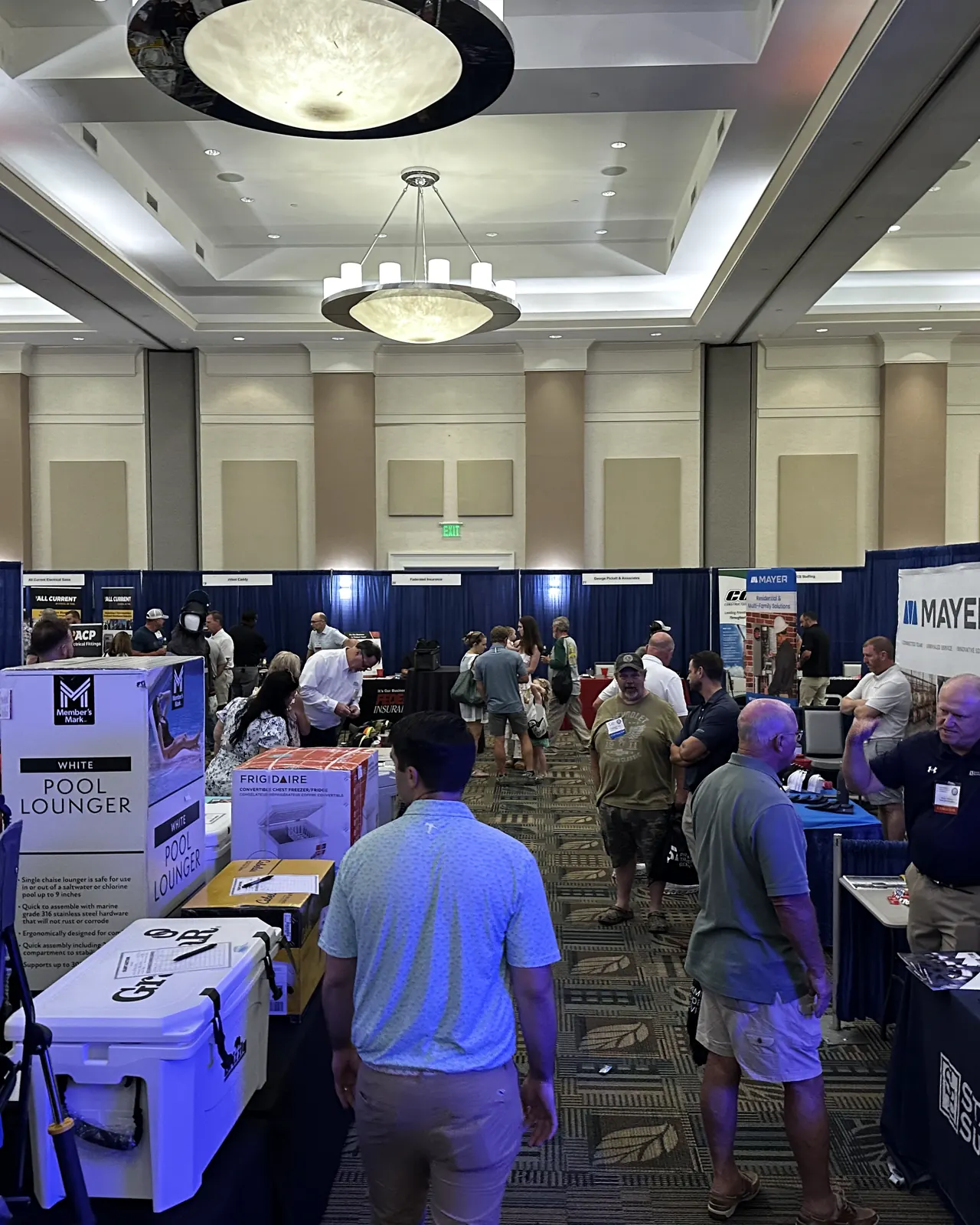 Attendees speaking on the NCAEC show floor